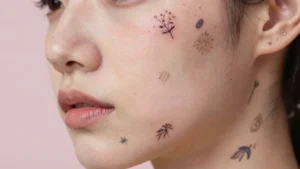 17 Small Face Tattoos for Women With Bold Personality