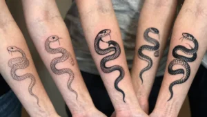 12 Snake Tattoos on the Arm With Strong Visual Impact